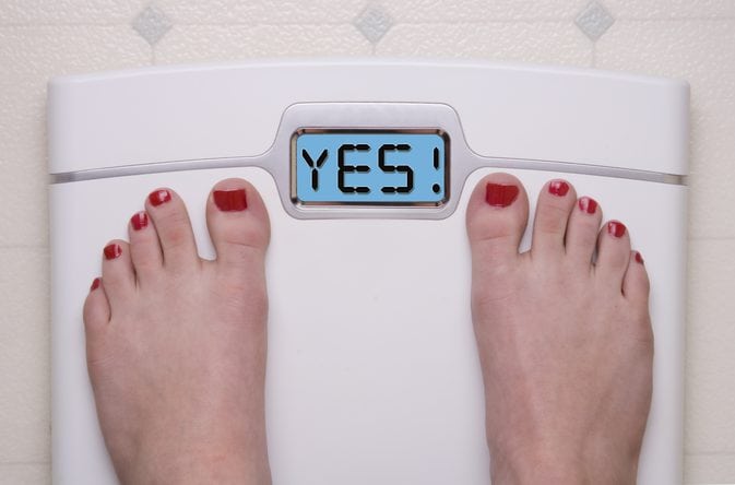 woman on weight scale